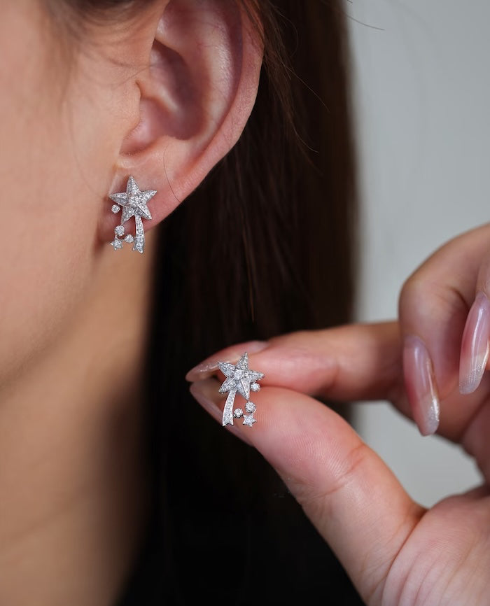 Radiant Starfall jewelry set featuring sparkling celestial star stud earrings and a matching adjustable ring crafted in white gold plated brass with premium grade zirconia.
