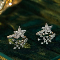 Radiant Starfall jewelry set featuring sparkling celestial star stud earrings and a matching adjustable ring crafted in white gold plated brass with premium grade zirconia.
