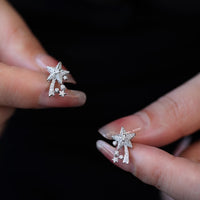 Radiant Starfall jewelry set featuring sparkling celestial star stud earrings and a matching adjustable ring crafted in white gold plated brass with premium grade zirconia.
