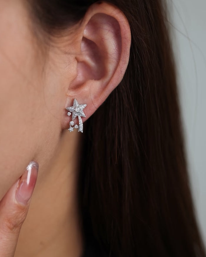 Radiant Starfall jewelry set featuring sparkling celestial star stud earrings and a matching adjustable ring crafted in white gold plated brass with premium grade zirconia.
