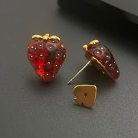 Sweet Strawberry Jewelry Set featuring glossy red strawberry stud earrings and a matching pendant necklace crafted in gold-plated brass with hand-finished resin enamel.
