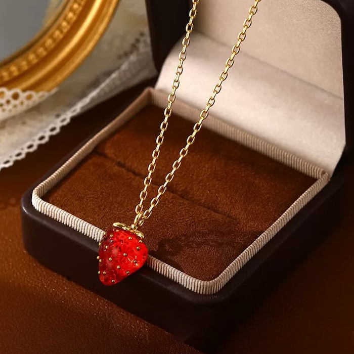 Sweet Strawberry Jewelry Set featuring glossy red strawberry stud earrings and a matching pendant necklace crafted in gold-plated brass with hand-finished resin enamel.
