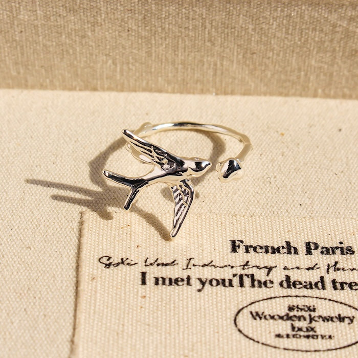Artistic Swallow Bird Ring featuring a sculptural swallow bird design in gold and silver-tone finishes with an adjustable open-ring style.
