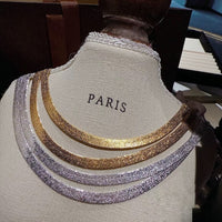 Ultra Shiny Layered Herringbone Chain Necklace featuring layered 7 mm herringbone chains with a highly polished finish in gold and silver-tone options.
