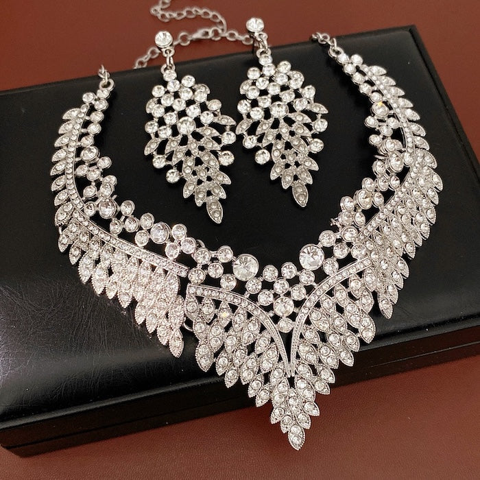 Grand Cascade Crystal Bridal Jewelry Set featuring a matching necklace and earrings with cascading marquise-cut premium-grade zirconia in a brilliant leaf-inspired design.