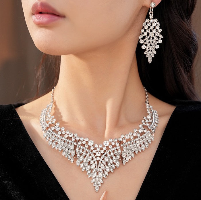 Grand Cascade Crystal Bridal Jewelry Set featuring a matching necklace and earrings with cascading marquise-cut premium-grade zirconia in a brilliant leaf-inspired design.