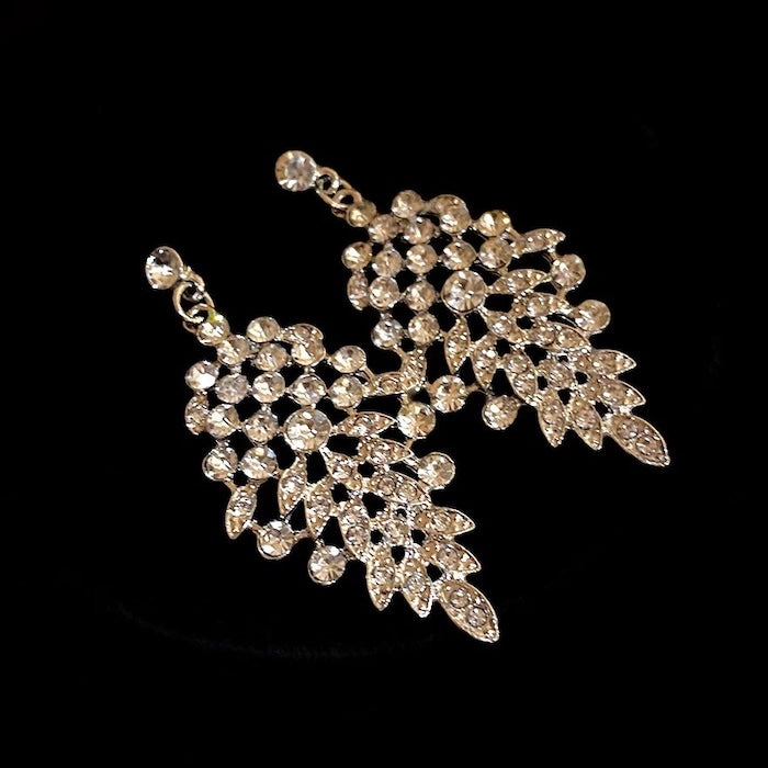Grand Cascade Crystal Bridal Jewelry Set featuring a matching necklace and earrings with cascading marquise-cut premium-grade zirconia in a brilliant leaf-inspired design.