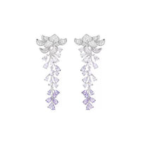 Dazzling Wisteria Flower Tassel Earrings featuring sparkling floral zirconia details and cascading lavender-toned crystal tassels in a silver-tone setting.
