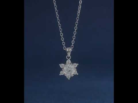 Luxe Moissanite Snowflake Necklace featuring a 1 ct round moissanite center stone surrounded by sparkling accent stones in a snowflake-inspired sterling silver pendant.