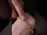 Kaleidoscope Clover Crystal Bracelet featuring gold-plated brass with multicoloured four-leaf clover motifs set with premium zirconia crystals and an adjustable chain.