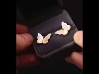 Iridescent Butterfly Shell Stud Earrings featuring luminous shell wings and delicate zirconia accents in a butterfly-inspired gold-tone design.