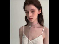 Sophisticated Silver Camellia Necklace and Earrings Set featuring delicate camellia-inspired floral details in a silver-plated finish with matching earrings.
