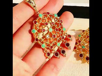 Vintage Dream Catcher Drop Earrings featuring intricate gold-tone openwork details with red and turquoise crystal accents in a statement drop design.
