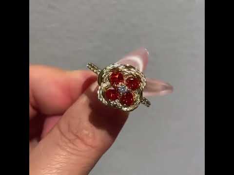 Turning Lucky Clover Jewelry Set featuring a rotating four-leaf clover with emerald green or ruby red crystals, pavé zirconia, and gold-plated settings in matching earrings, bracelet, and ring.