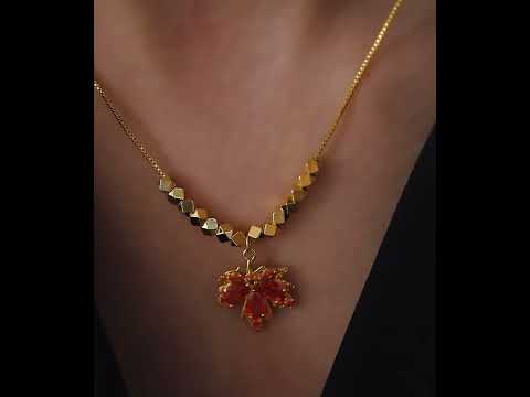 Fiery Orange Crystal Maple Leaf Necklace with orange crystal leaf pendant, faceted golden beads and delicate gold-plated chain.