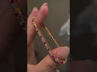 Dazzling Pink Ombré Tennis Bracelet featuring sparkling pink and clear zirconias in a gradient tennis bracelet design, available in two stone sizes.
